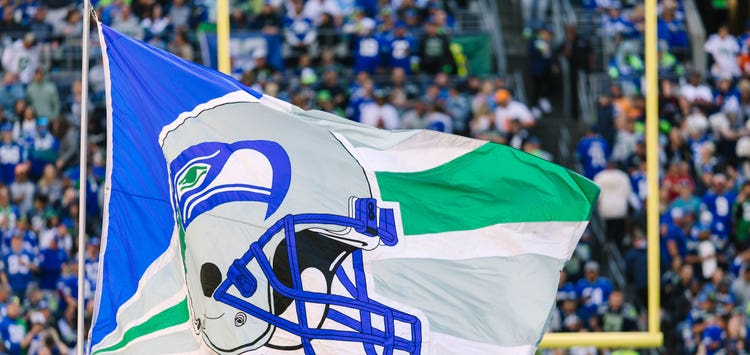 Seattle Seahawks 12th Man flag raised in the crowd